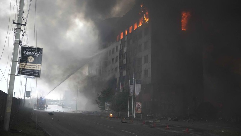 A building burns after shelling in Kyiv, Ukraine, Thursday, March 3, 2022. Russian forces have escalated their attacks on crowded cities in what Ukraine's leader called a blatant campaign of terror. (AP Photo/Efrem Lukatsky)
