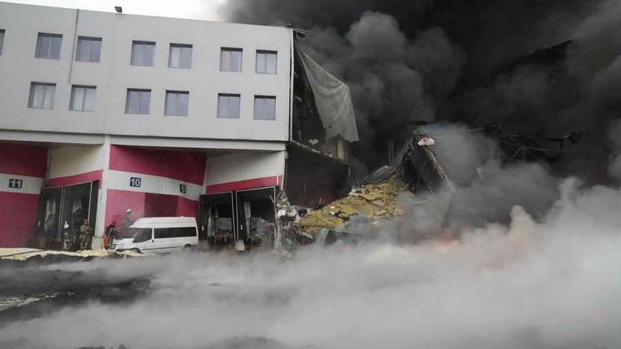 A building burns after shelling in Kyiv, Ukraine, Thursday, March 3, 2022. Russian forces have escalated their attacks on crowded cities in what Ukraine's leader called a blatant campaign of terror. (AP Photo/Efrem Lukatsky)