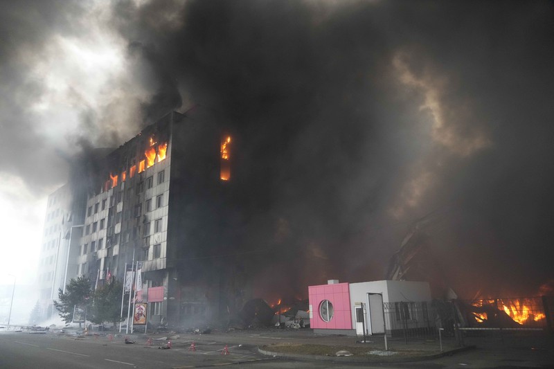 A building burns after shelling in Kyiv, Ukraine, Thursday, March 3, 2022. Russian forces have escalated their attacks on crowded cities in what Ukraine's leader called a blatant campaign of terror. (AP Photo/Efrem Lukatsky)