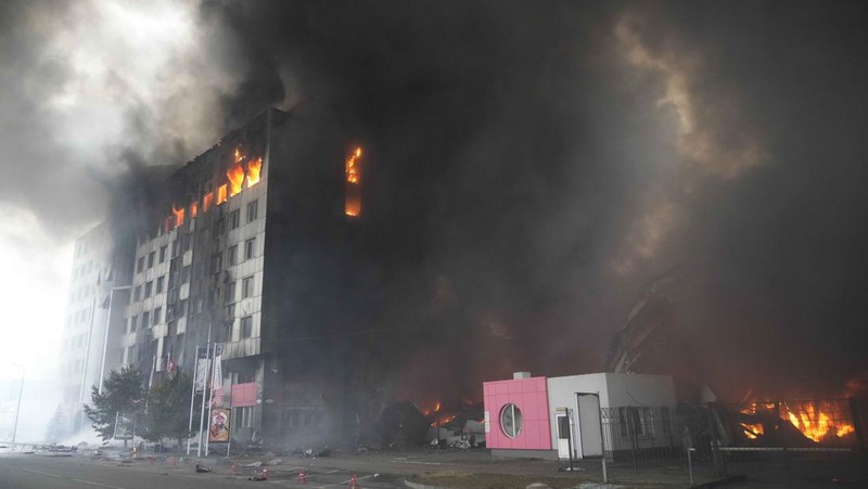 A building burns after shelling in Kyiv, Ukraine, Thursday, March 3, 2022. Russian forces have escalated their attacks on crowded cities in what Ukraine's leader called a blatant campaign of terror. (AP Photo/Efrem Lukatsky)