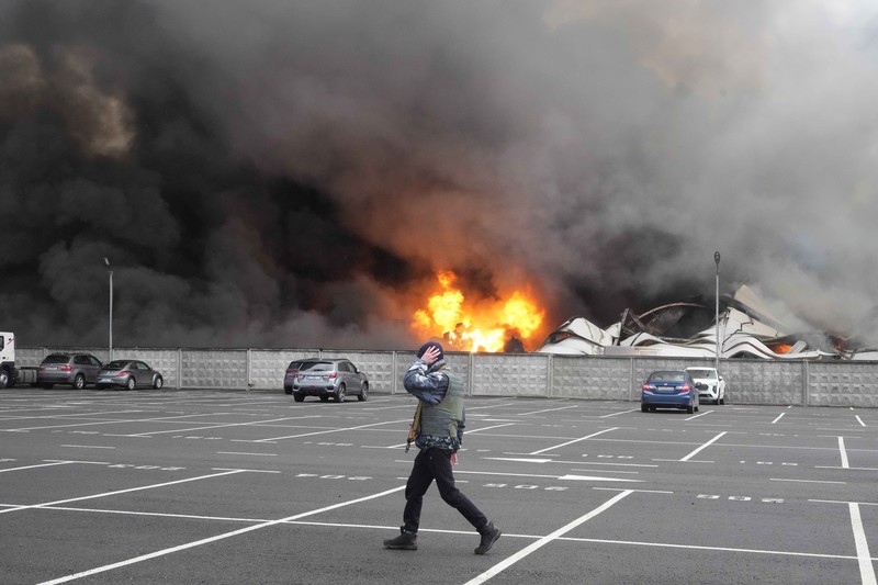 A building burns after shelling in Kyiv, Ukraine, Thursday, March 3, 2022. Russian forces have escalated their attacks on crowded cities in what Ukraine's leader called a blatant campaign of terror. (AP Photo/Efrem Lukatsky)