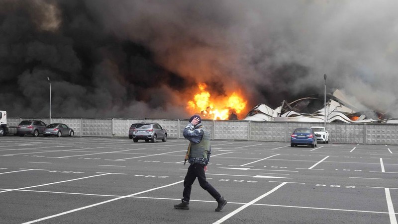 A building burns after shelling in Kyiv, Ukraine, Thursday, March 3, 2022. Russian forces have escalated their attacks on crowded cities in what Ukraine's leader called a blatant campaign of terror. (AP Photo/Efrem Lukatsky)