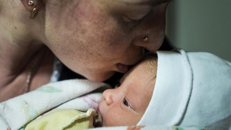 Medical workers tend to women who gave birth in a basement of a maternity hospital converted into a medical ward and used as a bomb shelter in Mariupol, Ukraine, Tuesday, March 1, 2022. Russian strikes on the key southern port city of Mariupol seriously wounded several people. (AP Photo/Evgeniy Maloletka)