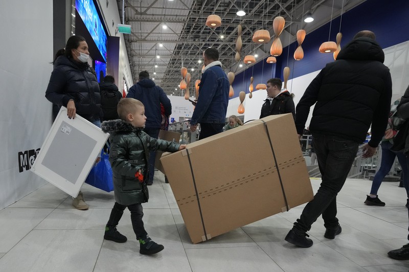 Russia Ukraine War Economy People wait in a line to enter the IKEA store at the outskirts of St. Petersburg, Russia, Thursday, March 3, 2022. IKEA is closing its stores and pausing all sourcing in Russia and Belarus from Friday, March 4.