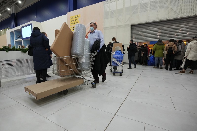 Russia Ukraine War Economy People wait in a line to enter the IKEA store at the outskirts of St. Petersburg, Russia, Thursday, March 3, 2022. IKEA is closing its stores and pausing all sourcing in Russia and Belarus from Friday, March 4.