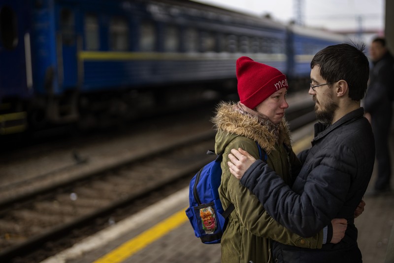 Russia Ukraine War Goodbyes Photo Gallery A couple says goodbye before she boards on a train bound for Lviv at the Kyiv station, Ukraine, Thursday, March 3. 2022. (AP Photo/Emilio Morenatti)