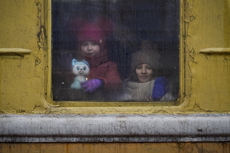 A couple says goodbye before she boards on a train bound for Lviv at the Kyiv station, Ukraine, Thursday, March 3. 2022. (AP Photo/Emilio Morenatti)