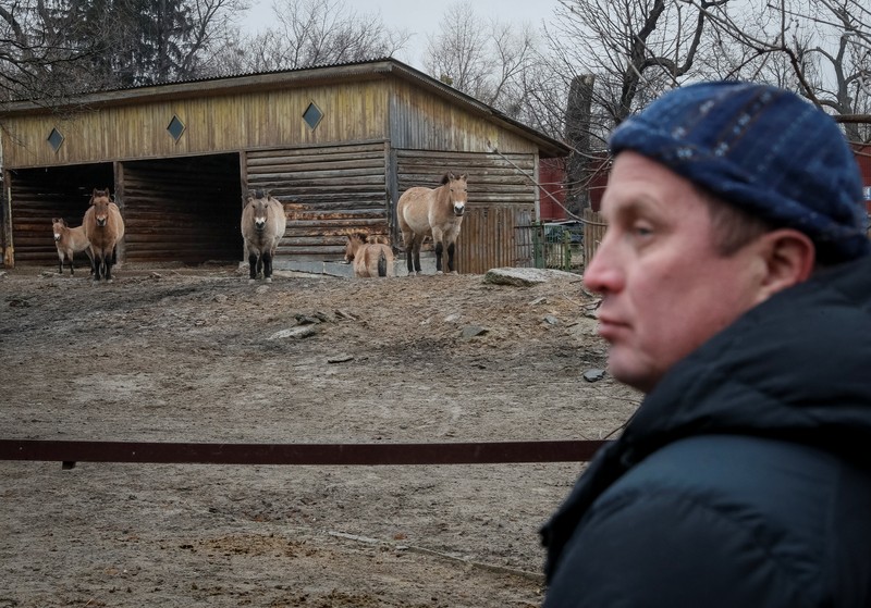 UKRAINE-CRISIS/KYIV-ZOO Trantin Kirill, zoo director, stands near an aviary with a hyena in the city zoo in Kyiv, Ukraine, March 3, 2022. REUTERS/Gleb Garanich