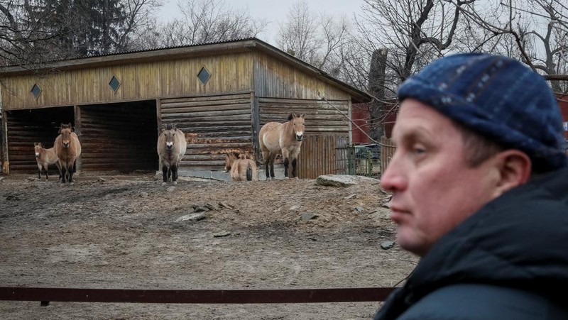 Trantin Kirill, zoo director, stands near an aviary with a hyena in the city zoo in Kyiv, Ukraine, March 3, 2022. REUTERS/Gleb Garanich
