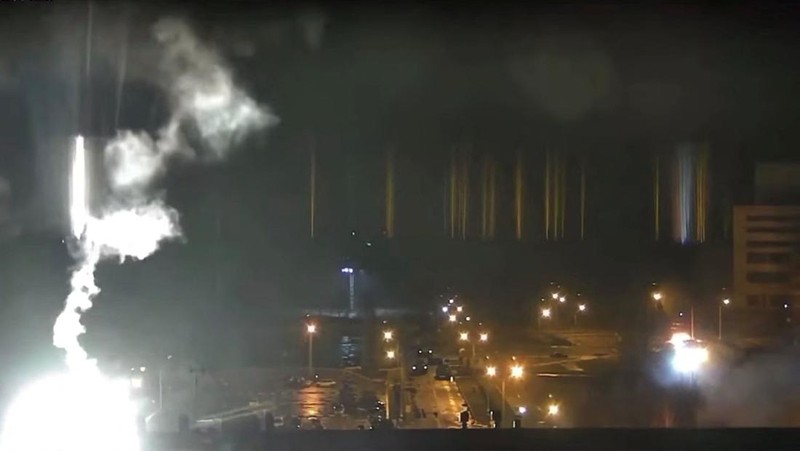 This image made from a video released by Zaporizhzhia nuclear power plant shows bright flaring object landing in grounds of the nuclear plant in Enerhodar, Ukraine Friday, March 4, 2022. Russian forces shelled Europe’s largest nuclear plant early Friday, sparking a fire as they pressed their attack on a crucial energy-producing Ukrainian city and gained ground in their bid to cut off the country from the sea. (Zaporizhzhia nuclear power plant via AP)