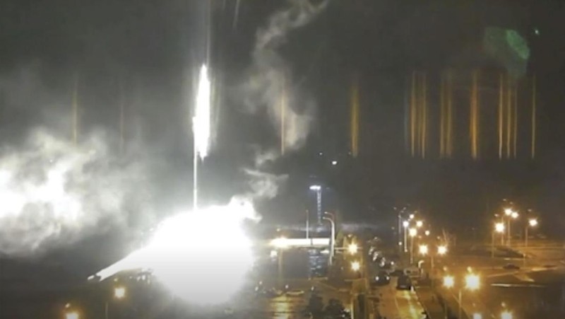 This image made from a video released by Zaporizhzhia nuclear power plant shows bright flaring object landing in grounds of the nuclear plant in Enerhodar, Ukraine Friday, March 4, 2022. Russian forces shelled Europe’s largest nuclear plant early Friday, sparking a fire as they pressed their attack on a crucial energy-producing Ukrainian city and gained ground in their bid to cut off the country from the sea. (Zaporizhzhia nuclear power plant via AP)