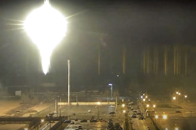 Ukraine Nuclear Plant This image made from a video released by Zaporizhzhia nuclear power plant shows bright flaring object landing in grounds of the nuclear plant in Enerhodar, Ukraine Friday, March 4, 2022. Russian forces shelled Europe’s largest nuclear plant early Friday, sparking a fire as they pressed their attack on a crucial energy-producing Ukrainian city and gained ground in their bid to cut off the country from the sea. (Zaporizhzhia nuclear power plant via AP)