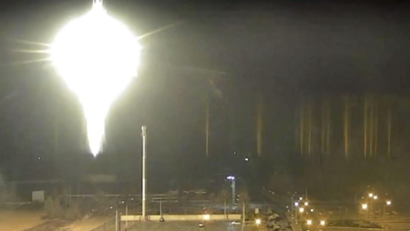 This image made from a video released by Zaporizhzhia nuclear power plant shows bright flaring object landing in grounds of the nuclear plant in Enerhodar, Ukraine Friday, March 4, 2022. Russian forces shelled Europe’s largest nuclear plant early Friday, sparking a fire as they pressed their attack on a crucial energy-producing Ukrainian city and gained ground in their bid to cut off the country from the sea. (Zaporizhzhia nuclear power plant via AP)