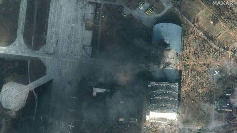 A satellite image collected over Antonov Airfield shows the destroyed former hangar of the Antonov An-225 Mriya sitting north of military vehicles clustered around main hangars and a static aircraft to south, as well as nearby warehouses now engulfed in flames as conflict continues in the area, Ukraine February 28, 2022.  BLACKSKY/Handout via REUTERS  THIS IMAGE HAS BEEN SUPPLIED BY A THIRD PARTY. MANDATORY CREDIT. NO RESALES. NO ARCHIVES. DO NOT OBSCURE LOGO
