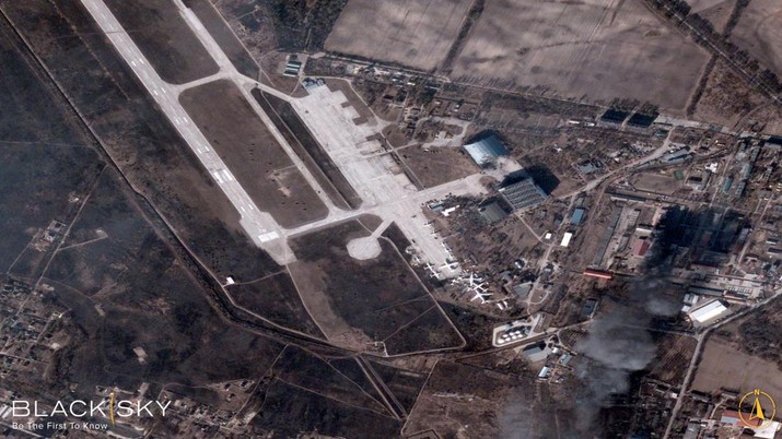 A satellite image collected over Antonov Airfield shows the destroyed former hangar of the Antonov An-225 Mriya sitting north of military vehicles clustered around main hangars and a static aircraft to south, as well as nearby warehouses now engulfed in flames as conflict continues in the area, Ukraine February 28, 2022.  BLACKSKY/Handout via REUTERS  THIS IMAGE HAS BEEN SUPPLIED BY A THIRD PARTY. MANDATORY CREDIT. NO RESALES. NO ARCHIVES. DO NOT OBSCURE LOGO