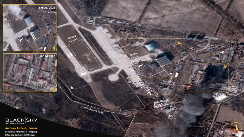 UKRAINE-CRISIS/SATELLITE 2 A satellite image collected over Antonov Airfield shows the destroyed former hangar of the Antonov An-225 Mriya sitting north of military vehicles clustered around main hangars and a static aircraft to south, as well as nearby warehouses now engulfed in flames as conflict continues in the area, Ukraine February 28, 2022. BLACKSKY/Handout via REUTERS THIS IMAGE HAS BEEN SUPPLIED BY A THIRD PARTY. MANDATORY CREDIT. NO RESALES. NO ARCHIVES. DO NOT OBSCURE LOGO