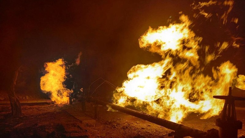 Facilities of a complex that prepares natural gas for transportation are pictured in a fire after night shelling, as Russia's attack on Ukraine continues, in the village of Hlazunivka in Kharkiv region, Ukraine, in this handout picture released March 13, 2022.  Press service of the State Emergency Service of Ukraine/Handout via REUTERS ATTENTION EDITORS - THIS IMAGE HAS BEEN SUPPLIED BY A THIRD PARTY. MANDATORY CREDIT.