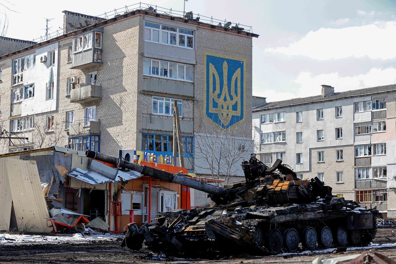 Service members of pro-Russian troops in uniforms without insignia are seen atop of armoured vehicles during Ukraine-Russia conflict outside the separatist-controlled town of Volnovakha in the Donetsk region, Ukraine March 12, 2022. REUTERS/Alexander Ermochenko