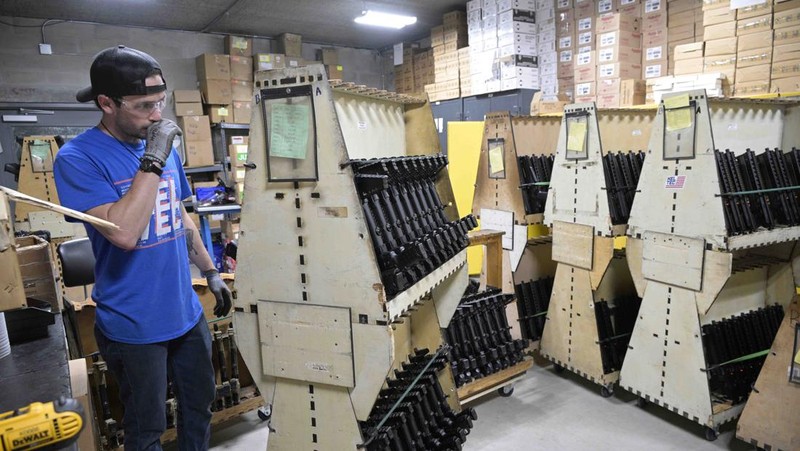 Adrian Kellgren, director of industrial production of KelTec, holds a 9mm SUB2000 rifle, similar to ones being shipped to Ukraine, at their manufacturing facility on Thursday, March 17, 2022, in Cocoa, Fla. Kellgren’s family-owned gun company was left holding a $200,000 shipment of semi-automatic rifles after a longtime customer in Odessa suddenly went silent during Vladimir Putin’s invasion of Ukraine. Fearing the worst, the company decided to put those stranded 400 guns to good use, sending them to Ukraine's nascent resistance movement. (AP Photo/Phelan M. Ebenhack)