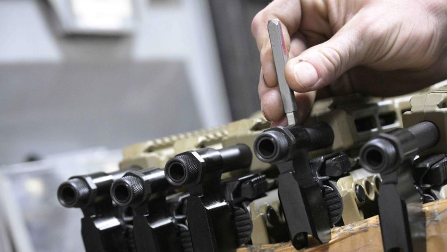 Adrian Kellgren, director of industrial production of KelTec, holds a 9mm SUB2000 rifle, similar to ones being shipped to Ukraine, at their manufacturing facility on Thursday, March 17, 2022, in Cocoa, Fla. Kellgren’s family-owned gun company was left holding a $200,000 shipment of semi-automatic rifles after a longtime customer in Odessa suddenly went silent during Vladimir Putin’s invasion of Ukraine. Fearing the worst, the company decided to put those stranded 400 guns to good use, sending them to Ukraine's nascent resistance movement. (AP Photo/Phelan M. Ebenhack)
