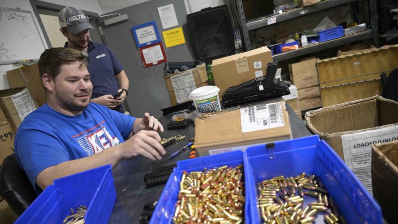 Adrian Kellgren, director of industrial production of KelTec, holds a 9mm SUB2000 rifle, similar to ones being shipped to Ukraine, at their manufacturing facility on Thursday, March 17, 2022, in Cocoa, Fla. Kellgren’s family-owned gun company was left holding a $200,000 shipment of semi-automatic rifles after a longtime customer in Odessa suddenly went silent during Vladimir Putin’s invasion of Ukraine. Fearing the worst, the company decided to put those stranded 400 guns to good use, sending them to Ukraine's nascent resistance movement. (AP Photo/Phelan M. Ebenhack)