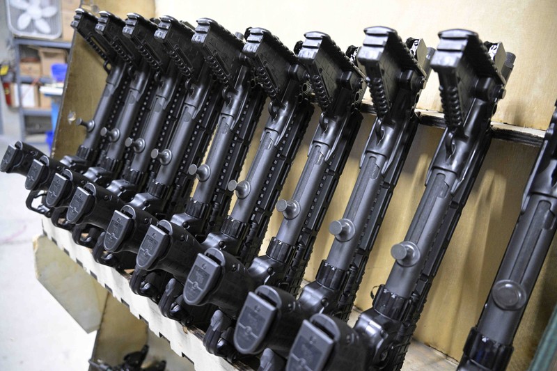 Russia Ukraine War Americans Giving Guns Adrian Kellgren, director of industrial production of KelTec, holds a 9mm SUB2000 rifle, similar to ones being shipped to Ukraine, at their manufacturing facility on Thursday, March 17, 2022, in Cocoa, Fla. Kellgren’s family-owned gun company was left holding a $200,000 shipment of semi-automatic rifles after a longtime customer in Odessa suddenly went silent during Vladimir Putin’s invasion of Ukraine. Fearing the worst, the company decided to put those stranded 400 guns to good use, sending them to Ukraine's nascent resistance movement. (AP Photo/Phelan M. Ebenhack)