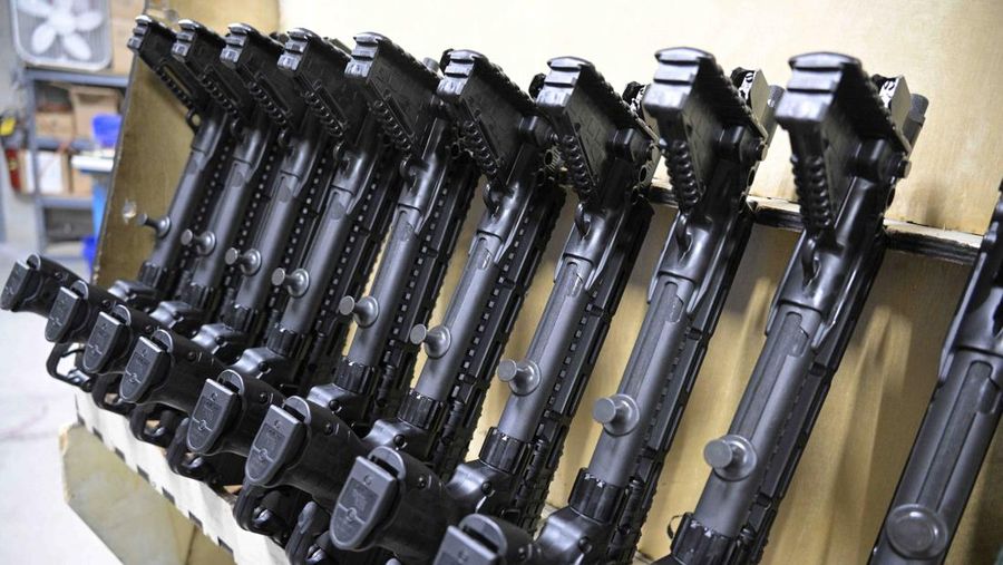 Adrian Kellgren, director of industrial production of KelTec, holds a 9mm SUB2000 rifle, similar to ones being shipped to Ukraine, at their manufacturing facility on Thursday, March 17, 2022, in Cocoa, Fla. Kellgren’s family-owned gun company was left holding a $200,000 shipment of semi-automatic rifles after a longtime customer in Odessa suddenly went silent during Vladimir Putin’s invasion of Ukraine. Fearing the worst, the company decided to put those stranded 400 guns to good use, sending them to Ukraine's nascent resistance movement. (AP Photo/Phelan M. Ebenhack)