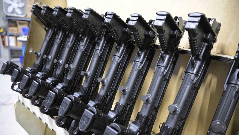 Adrian Kellgren, director of industrial production of KelTec, holds a 9mm SUB2000 rifle, similar to ones being shipped to Ukraine, at their manufacturing facility on Thursday, March 17, 2022, in Cocoa, Fla. Kellgren’s family-owned gun company was left holding a $200,000 shipment of semi-automatic rifles after a longtime customer in Odessa suddenly went silent during Vladimir Putin’s invasion of Ukraine. Fearing the worst, the company decided to put those stranded 400 guns to good use, sending them to Ukraine's nascent resistance movement. (AP Photo/Phelan M. Ebenhack)