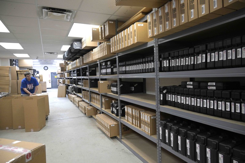 Adrian Kellgren, director of industrial production of KelTec, holds a 9mm SUB2000 rifle, similar to ones being shipped to Ukraine, at their manufacturing facility on Thursday, March 17, 2022, in Cocoa, Fla. Kellgren’s family-owned gun company was left holding a $200,000 shipment of semi-automatic rifles after a longtime customer in Odessa suddenly went silent during Vladimir Putin’s invasion of Ukraine. Fearing the worst, the company decided to put those stranded 400 guns to good use, sending them to Ukraine's nascent resistance movement. (AP Photo/Phelan M. Ebenhack)