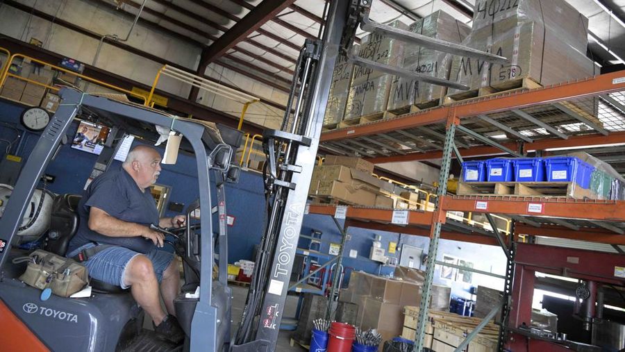 Adrian Kellgren, director of industrial production of KelTec, holds a 9mm SUB2000 rifle, similar to ones being shipped to Ukraine, at their manufacturing facility on Thursday, March 17, 2022, in Cocoa, Fla. Kellgren’s family-owned gun company was left holding a $200,000 shipment of semi-automatic rifles after a longtime customer in Odessa suddenly went silent during Vladimir Putin’s invasion of Ukraine. Fearing the worst, the company decided to put those stranded 400 guns to good use, sending them to Ukraine's nascent resistance movement. (AP Photo/Phelan M. Ebenhack)