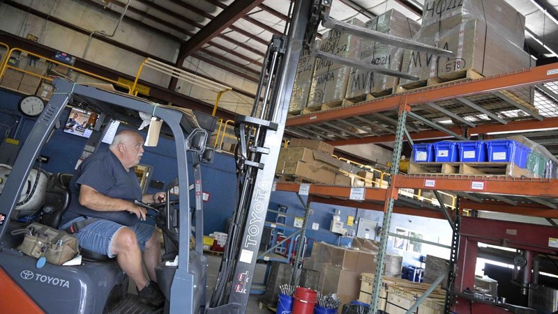 Adrian Kellgren, director of industrial production of KelTec, holds a 9mm SUB2000 rifle, similar to ones being shipped to Ukraine, at their manufacturing facility on Thursday, March 17, 2022, in Cocoa, Fla. Kellgren’s family-owned gun company was left holding a $200,000 shipment of semi-automatic rifles after a longtime customer in Odessa suddenly went silent during Vladimir Putin’s invasion of Ukraine. Fearing the worst, the company decided to put those stranded 400 guns to good use, sending them to Ukraine's nascent resistance movement. (AP Photo/Phelan M. Ebenhack)