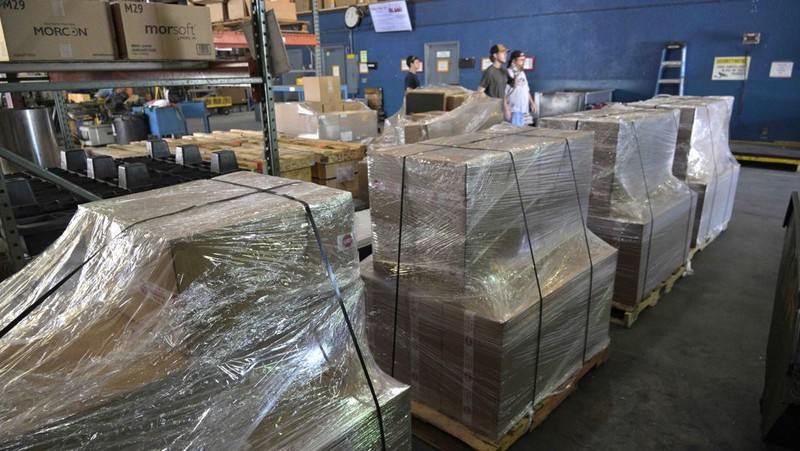 Adrian Kellgren, director of industrial production of KelTec, holds a 9mm SUB2000 rifle, similar to ones being shipped to Ukraine, at their manufacturing facility on Thursday, March 17, 2022, in Cocoa, Fla. Kellgren’s family-owned gun company was left holding a $200,000 shipment of semi-automatic rifles after a longtime customer in Odessa suddenly went silent during Vladimir Putin’s invasion of Ukraine. Fearing the worst, the company decided to put those stranded 400 guns to good use, sending them to Ukraine's nascent resistance movement. (AP Photo/Phelan M. Ebenhack)