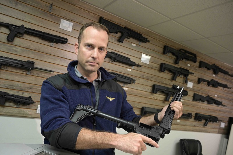 Russia Ukraine War Americans Giving Guns Adrian Kellgren, director of industrial production of KelTec, holds a 9mm SUB2000 rifle, similar to ones being shipped to Ukraine, at their manufacturing facility on Thursday, March 17, 2022, in Cocoa, Fla. Kellgren’s family-owned gun company was left holding a $200,000 shipment of semi-automatic rifles after a longtime customer in Odessa suddenly went silent during Vladimir Putin’s invasion of Ukraine. Fearing the worst, the company decided to put those stranded 400 guns to good use, sending them to Ukraine's nascent resistance movement. (AP Photo/Phelan M. Ebenhack)