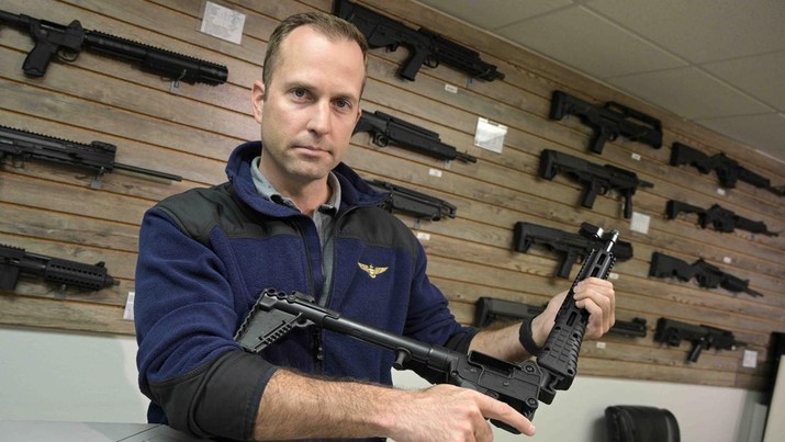 Russia Ukraine War Americans Giving Guns Adrian Kellgren, director of industrial production of KelTec, holds a 9mm SUB2000 rifle, similar to ones being shipped to Ukraine, at their manufacturing facility on Thursday, March 17, 2022, in Cocoa, Fla. Kellgren’s family-owned gun company was left holding a $200,000 shipment of semi-automatic rifles after a longtime customer in Odessa suddenly went silent during Vladimir Putin’s invasion of Ukraine. Fearing the worst, the company decided to put those stranded 400 guns to good use, sending them to Ukraine's nascent resistance movement. (AP Photo/Phelan M. Ebenhack)