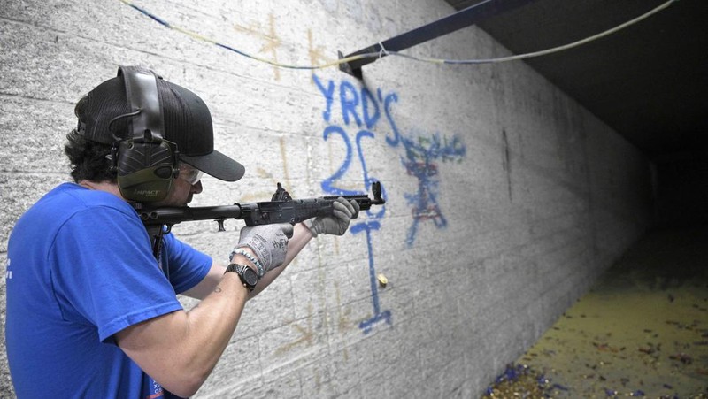 Adrian Kellgren, director of industrial production of KelTec, holds a 9mm SUB2000 rifle, similar to ones being shipped to Ukraine, at their manufacturing facility on Thursday, March 17, 2022, in Cocoa, Fla. Kellgren’s family-owned gun company was left holding a $200,000 shipment of semi-automatic rifles after a longtime customer in Odessa suddenly went silent during Vladimir Putin’s invasion of Ukraine. Fearing the worst, the company decided to put those stranded 400 guns to good use, sending them to Ukraine's nascent resistance movement. (AP Photo/Phelan M. Ebenhack)