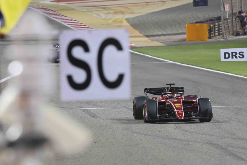 Bahrain F1 GP Auto Racing Ferrari driver Charles Leclerc of Monaco celebrates after he won the Formula One Bahrain Grand Prix it in Sakhir, Bahrain, Sunday, March 20, 2022. (AP Photo/Hassan Ammar)