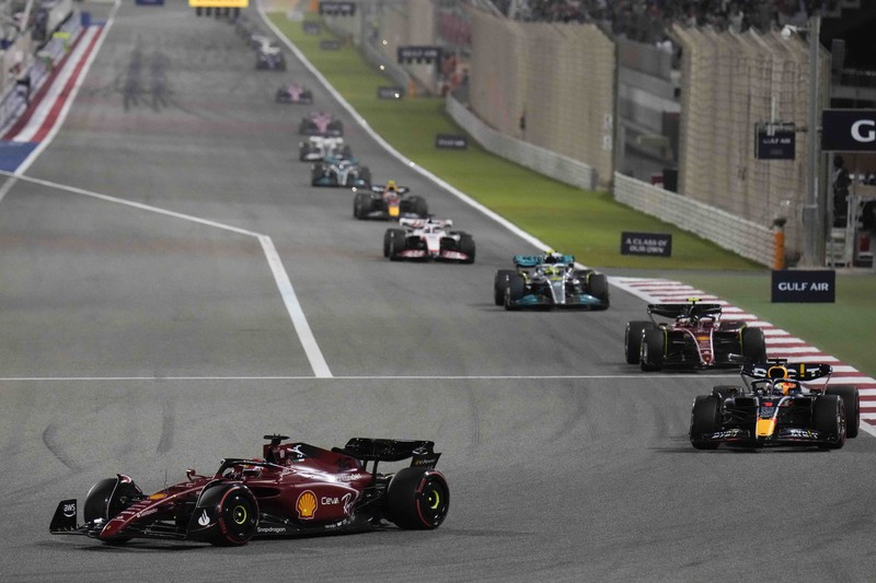 Ferrari driver Charles Leclerc of Monaco celebrates after he won the Formula One Bahrain Grand Prix it in Sakhir, Bahrain, Sunday, March 20, 2022. (AP Photo/Hassan Ammar)