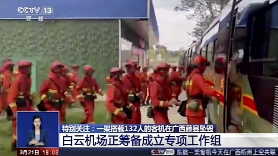 In this image taken from video footage run by China's CCTV, emergency personnel prepare to travel to the site of a plane crash near Wuzhou in southwestern China's Guangxi Zhuang Autonomous Region, Monday, March 21, 2022. A China Eastern Boeing 737-800 with more than 100 people on board crashed in the southern province of Guangxi on Monday, officials said. (CCTV via AP)