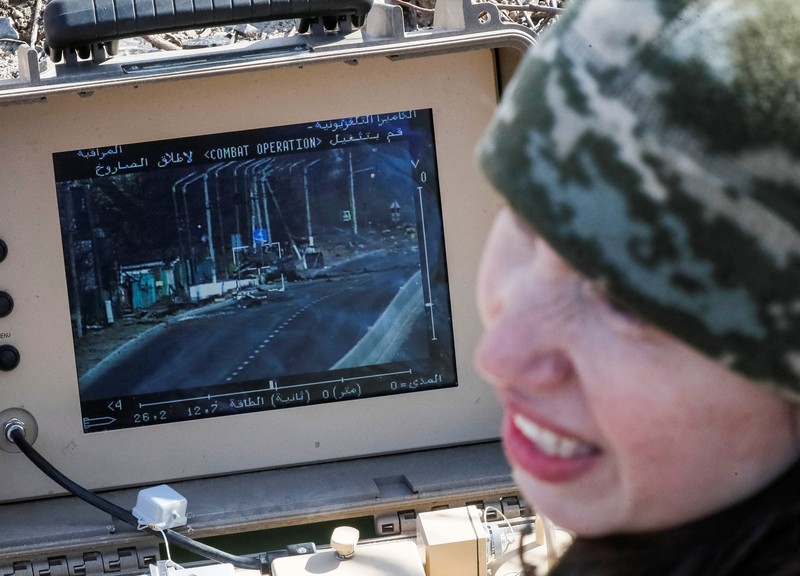 UKRAINE-CRISIS/FRONTLINE-FEMALE FIGHTER Tetiana Chornovol, former member of the Ukrainian Parliament, service member and operator of an anti-tank guided missile weapon system is pictured at a position on the front line, amid Russia's invasion of Ukraine, in the Kyiv region, Ukraine March 20, 2022. REUTERS/Gleb Garanich