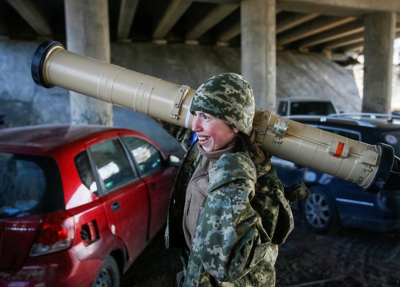 UKRAINE-CRISIS/FRONTLINE-FEMALE FIGHTER Tetiana Chornovol, former member of the Ukrainian Parliament, service member and operator of an anti-tank guided missile weapon system is pictured at a position on the front line, amid Russia's invasion of Ukraine, in the Kyiv region, Ukraine March 20, 2022. REUTERS/Gleb Garanich
