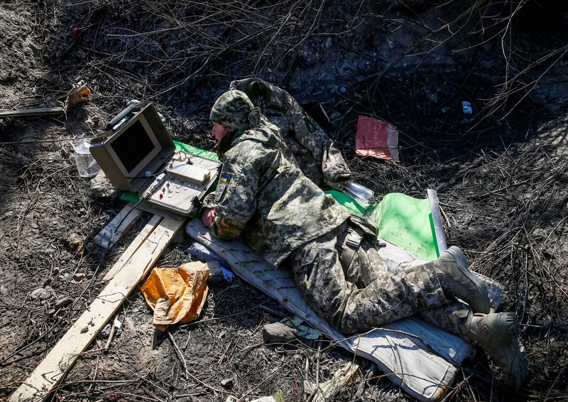 UKRAINE-CRISIS/FRONTLINE-FEMALE FIGHTER Tetiana Chornovol, former member of the Ukrainian Parliament, service member and operator of an anti-tank guided missile weapon system is pictured at a position on the front line, amid Russia's invasion of Ukraine, in the Kyiv region, Ukraine March 20, 2022. REUTERS/Gleb Garanich