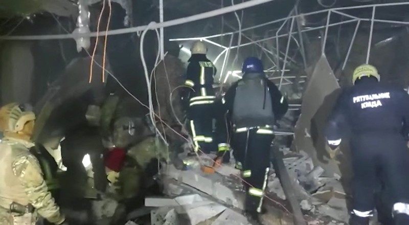 UKRAINE-CRISIS/KYIV-BLASTS Fire burns after a blast hits a shopping centre, in Kyiv, Ukraine, in this still image obtained from a handout video released on March 20, 2022. State Emergency Service of Ukraine/Handout via REUTERS ATTENTION EDITORS - THIS IMAGE HAS BEEN SUPPLIED BY A THIRD PARTY. MANDATORY CREDIT. NO RESALES. NO ARCHIVES