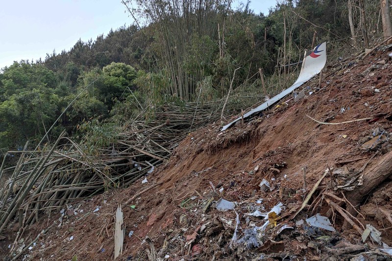 China Plane Crash In this photo taken by mobile phone released by Xinhua News Agency, a piece of wreckage of the China Eastern's flight MU5735 are seen after it crashed on the mountain in Tengxian County, south China's Guangxi Zhuang Autonomous Region on Monday, March 21, 2022. A China Eastern Boeing 737-800 with 132 people on board crashed in a remote mountainous area of southern China on Monday, officials said, setting off a forest fire visible from space in the country's worst air disaster in nearly a decade. (Xinhua via AP)