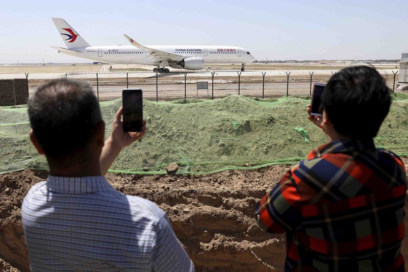China Plane Crash In this photo taken by mobile phone released by Xinhua News Agency, a piece of wreckage of the China Eastern's flight MU5735 are seen after it crashed on the mountain in Tengxian County, south China's Guangxi Zhuang Autonomous Region on Monday, March 21, 2022. A China Eastern Boeing 737-800 with 132 people on board crashed in a remote mountainous area of southern China on Monday, officials said, setting off a forest fire visible from space in the country's worst air disaster in nearly a decade. (Xinhua via AP)