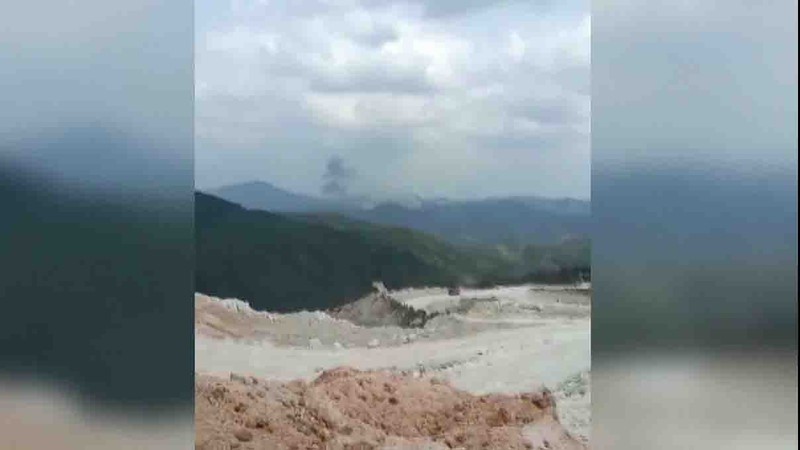 In this photo taken by mobile phone released by Xinhua News Agency, a piece of wreckage of the China Eastern's flight MU5735 are seen after it crashed on the mountain in Tengxian County, south China's Guangxi Zhuang Autonomous Region on Monday, March 21, 2022. A China Eastern Boeing 737-800 with 132 people on board crashed in a remote mountainous area of southern China on Monday, officials said, setting off a forest fire visible from space in the country's worst air disaster in nearly a decade. (Xinhua via AP)