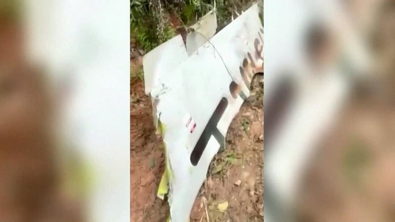 In this photo taken by mobile phone released by Xinhua News Agency, a piece of wreckage of the China Eastern's flight MU5735 are seen after it crashed on the mountain in Tengxian County, south China's Guangxi Zhuang Autonomous Region on Monday, March 21, 2022. A China Eastern Boeing 737-800 with 132 people on board crashed in a remote mountainous area of southern China on Monday, officials said, setting off a forest fire visible from space in the country's worst air disaster in nearly a decade. (Xinhua via AP)