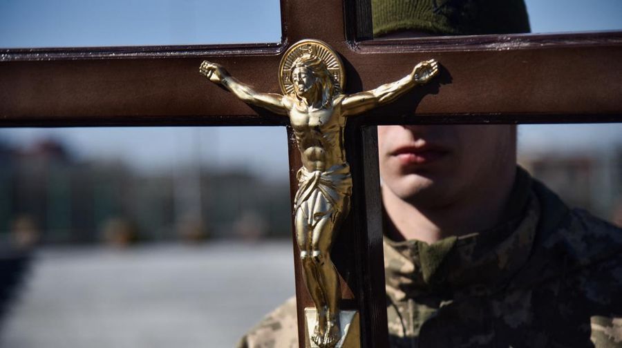 The mother of Major Ivan Skrypnyk, who died as a result of Russia's missile attack on the Ukrainian military base in Yavoriv, reacts during his funeral, following Russia's invasion of Ukraine, at Lychakiv Cemetery, in Lviv, Ukraine, March 17, 2022. REUTERS/Pavlo Palamarchuk