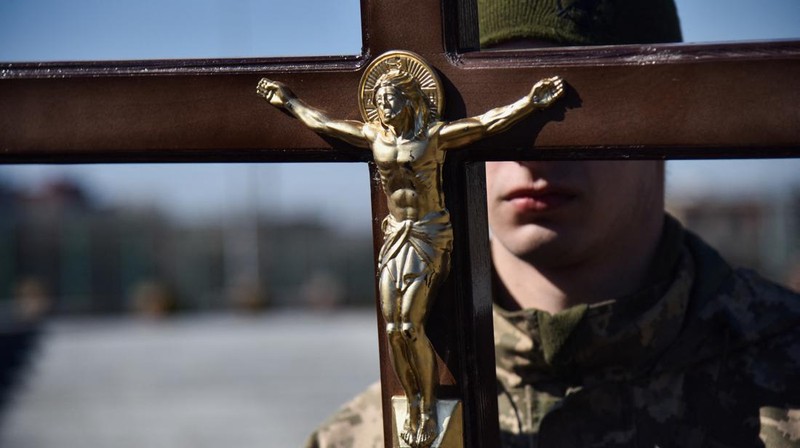 The mother of Major Ivan Skrypnyk, who died as a result of Russia's missile attack on the Ukrainian military base in Yavoriv, reacts during his funeral, following Russia's invasion of Ukraine, at Lychakiv Cemetery, in Lviv, Ukraine, March 17, 2022. REUTERS/Pavlo Palamarchuk