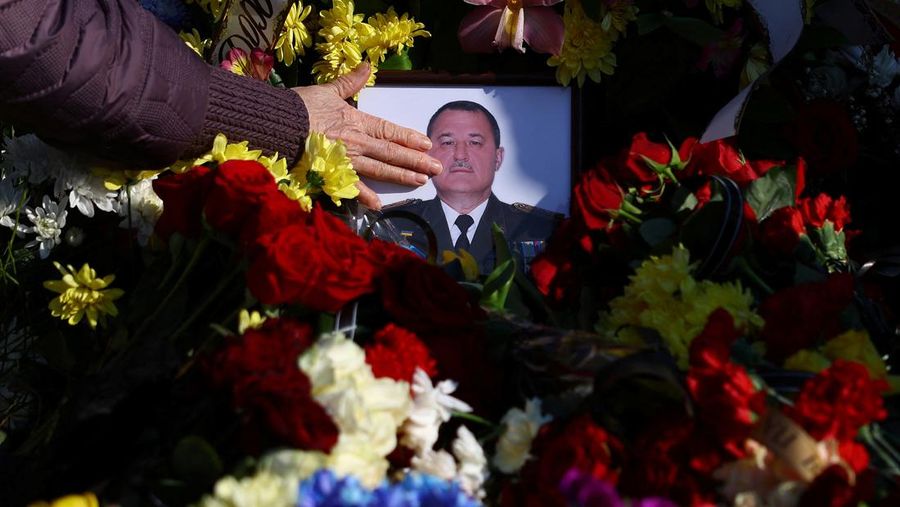 The mother of Major Ivan Skrypnyk, who died as a result of Russia's missile attack on the Ukrainian military base in Yavoriv, reacts during his funeral, following Russia's invasion of Ukraine, at Lychakiv Cemetery, in Lviv, Ukraine, March 17, 2022. REUTERS/Pavlo Palamarchuk