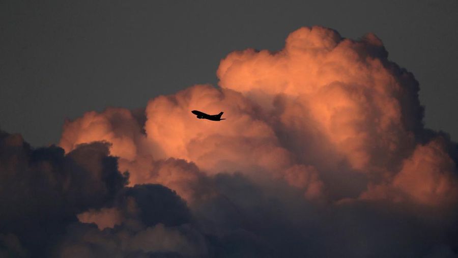 A Southwest Airlines 737 jet passes by cumulonimbus clouds as it takes off from Sky Harbor International Airport Saturday, Feb. 22, 2020, in Phoenix. (AP Photo/Charlie Riedel)